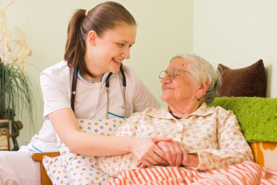 young nurse visiting an elderly woman